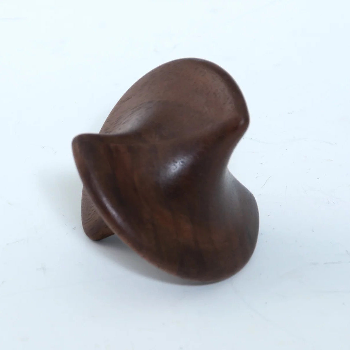 A sculptural dark wood object