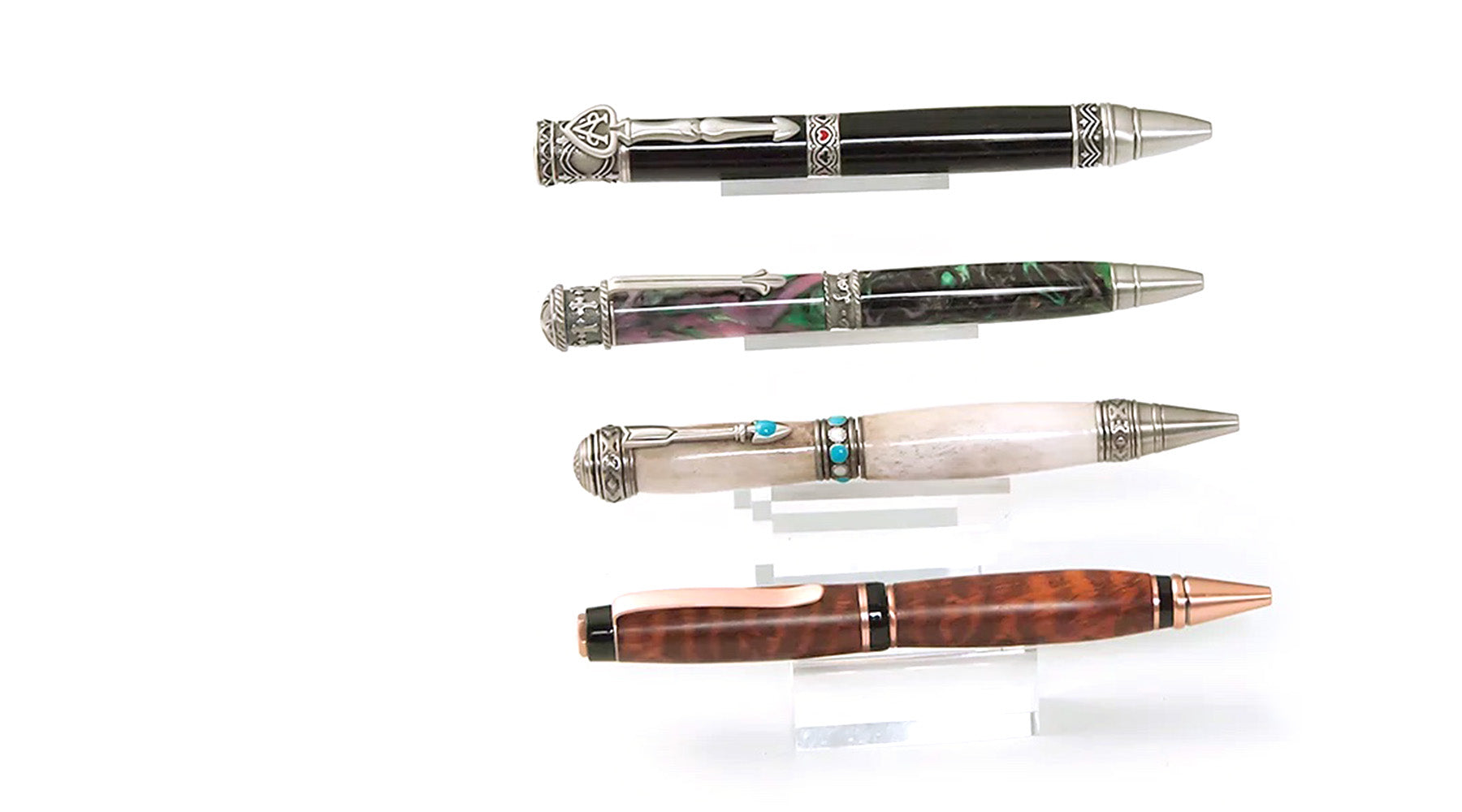 Four unique woodturned pens in various materials
